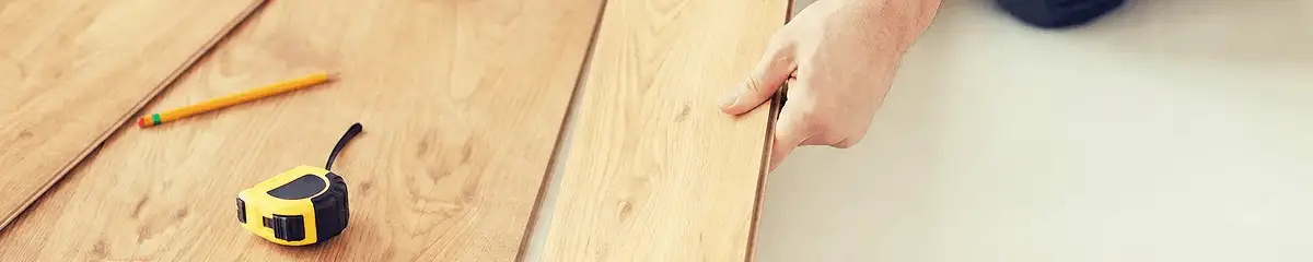 A professional installing wood flooring in Fort Wayne, IN