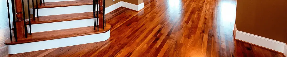 Base floor of a staircase with professionally restored wood flooring in Fort Wayne IN