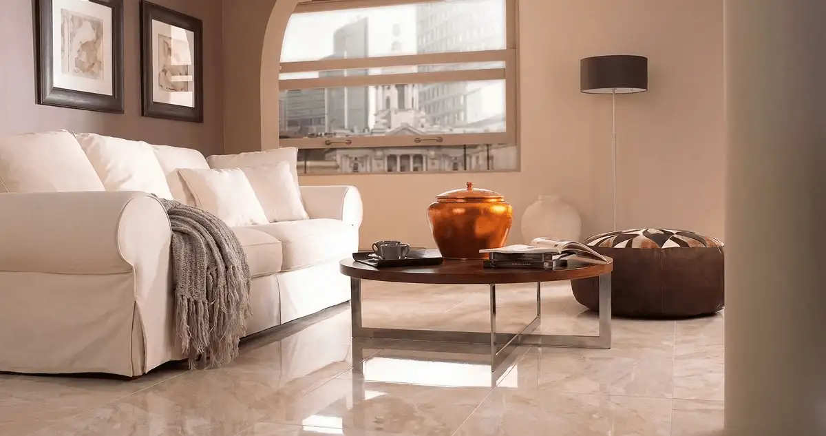 Modern living room with professionally installed marble flooring, a beige sofa, coffee table in Fort Wayne, IN