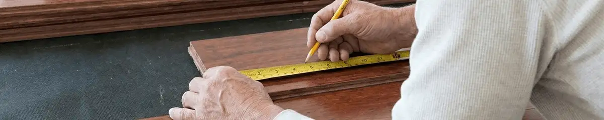 A professional installing wood flooring in Fort Wayne, IN